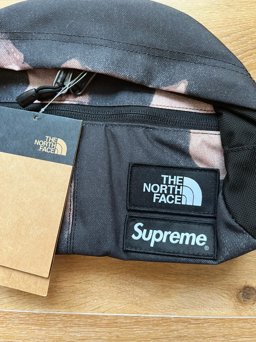 The North Face logo camo bag