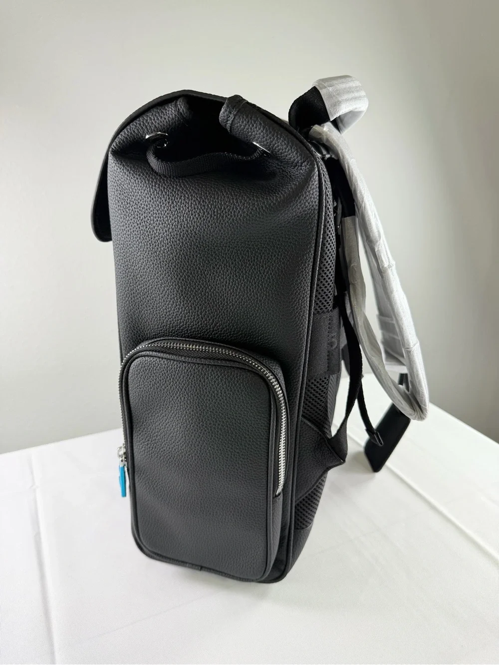 RIMOWA Black Textured Leather Backpack with Blue Zip Accents