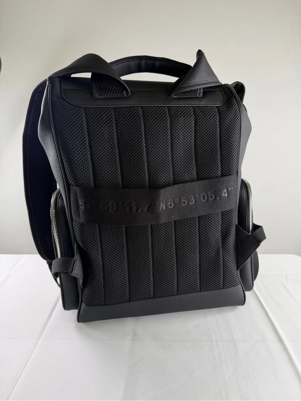RIMOWA Black Textured Leather Backpack with Blue Zip Accents