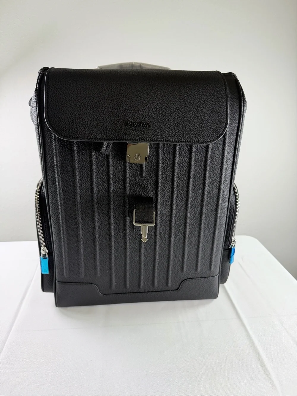 RIMOWA Black Textured Leather Backpack with Blue Zip Accents