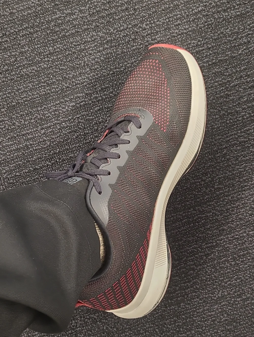 Skechers Men's Black Knit Athletic Shoes with Red Detail