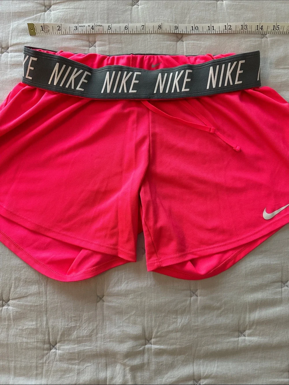 Nike Women's Neon Pink Athletic Shorts with Swoosh