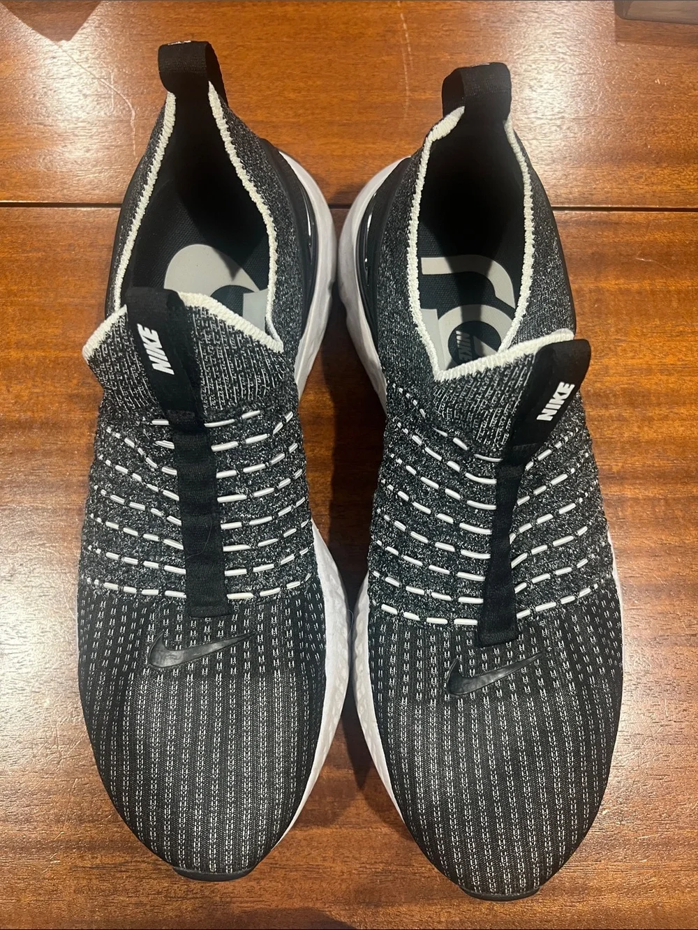 Nike Men’s Black and White Knit Slip-On Sneakers