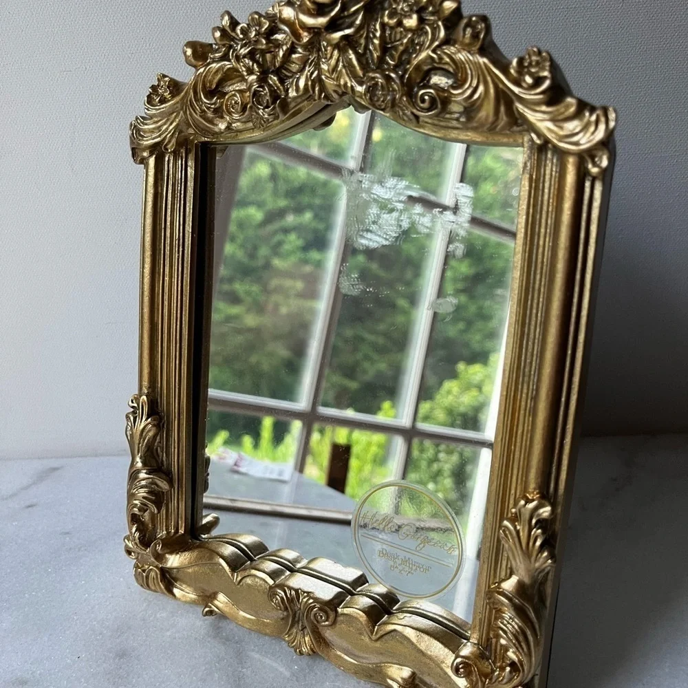 Nicole Miller gold ornate