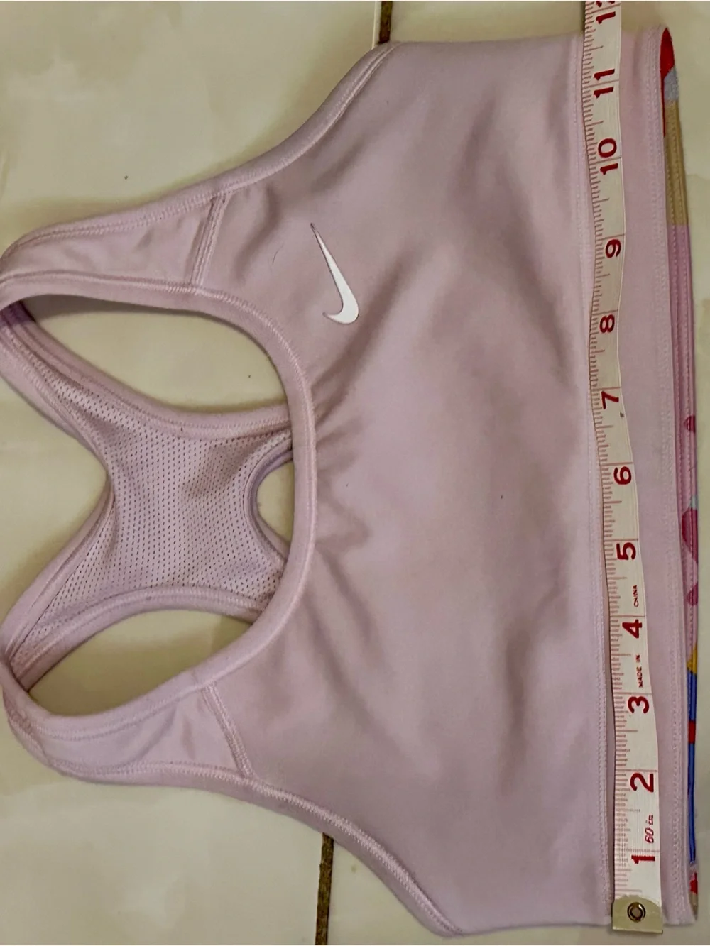 Nike Light Pink Racerback Sports Bra with White Swoosh
