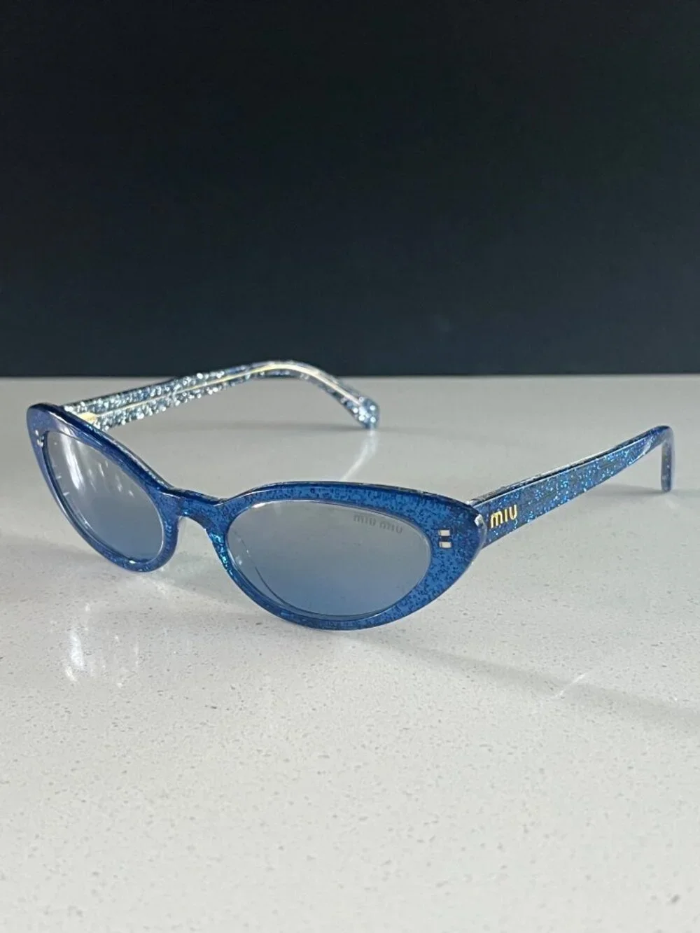 Miu Miu MU 09US 1452B2 blue glitter cat-eye sunglasses