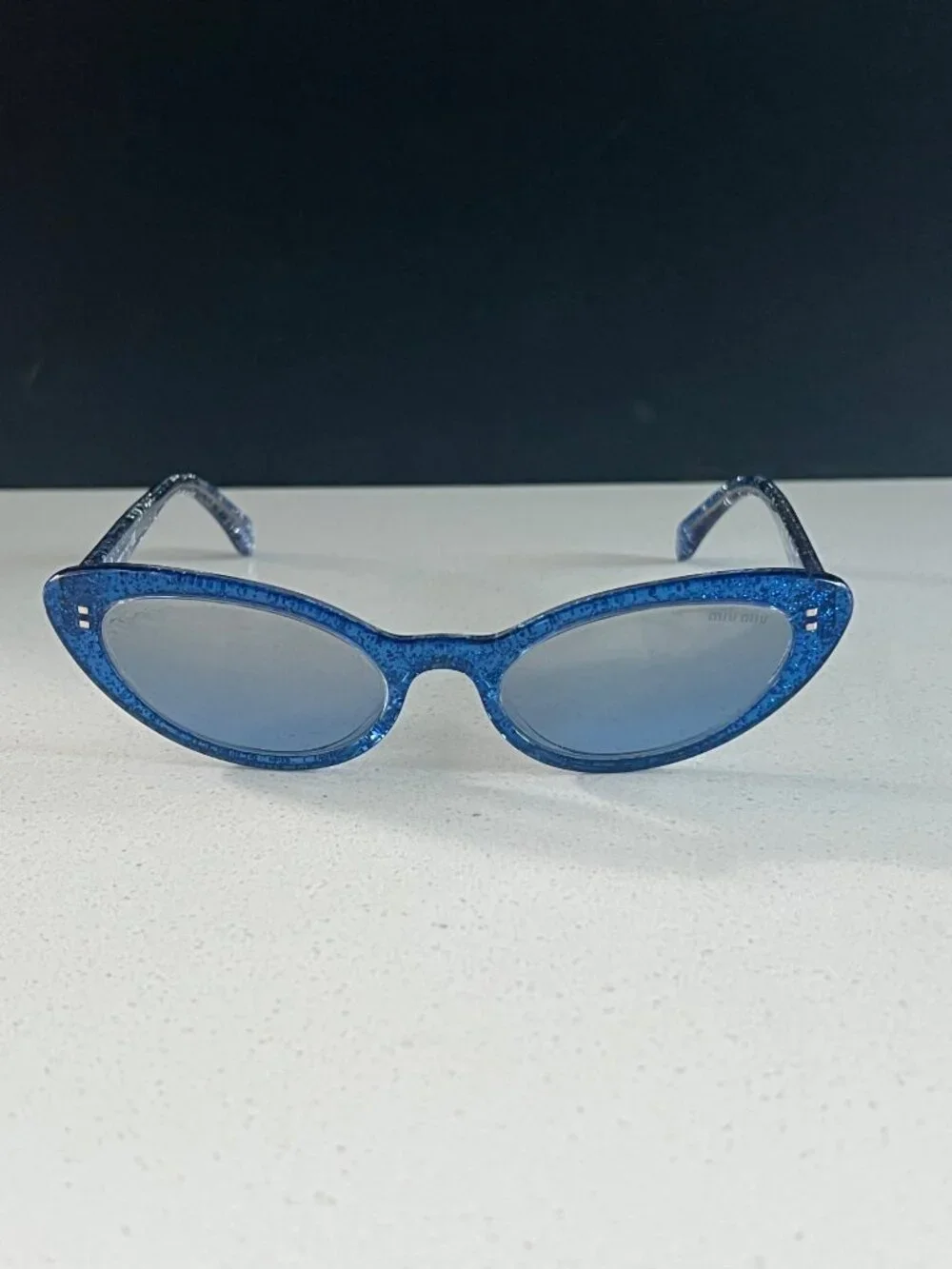 Miu Miu MU 09US 1452B2 blue glitter cat-eye sunglasses