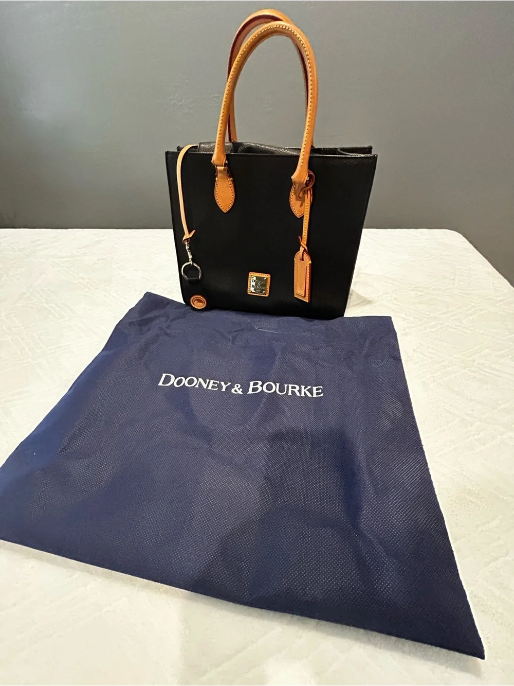 Dooney and Bourke Black Leather Satchel with Tan Leather Handles and Key Fob