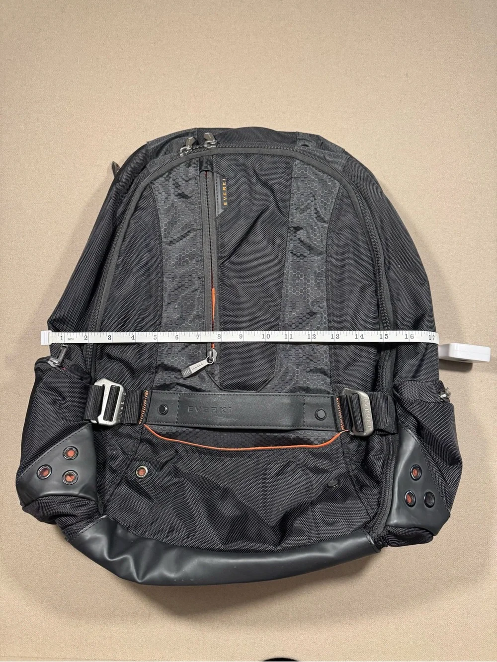 Black Men's Travel Backpack with Orange Accents Everki large laptop bag.