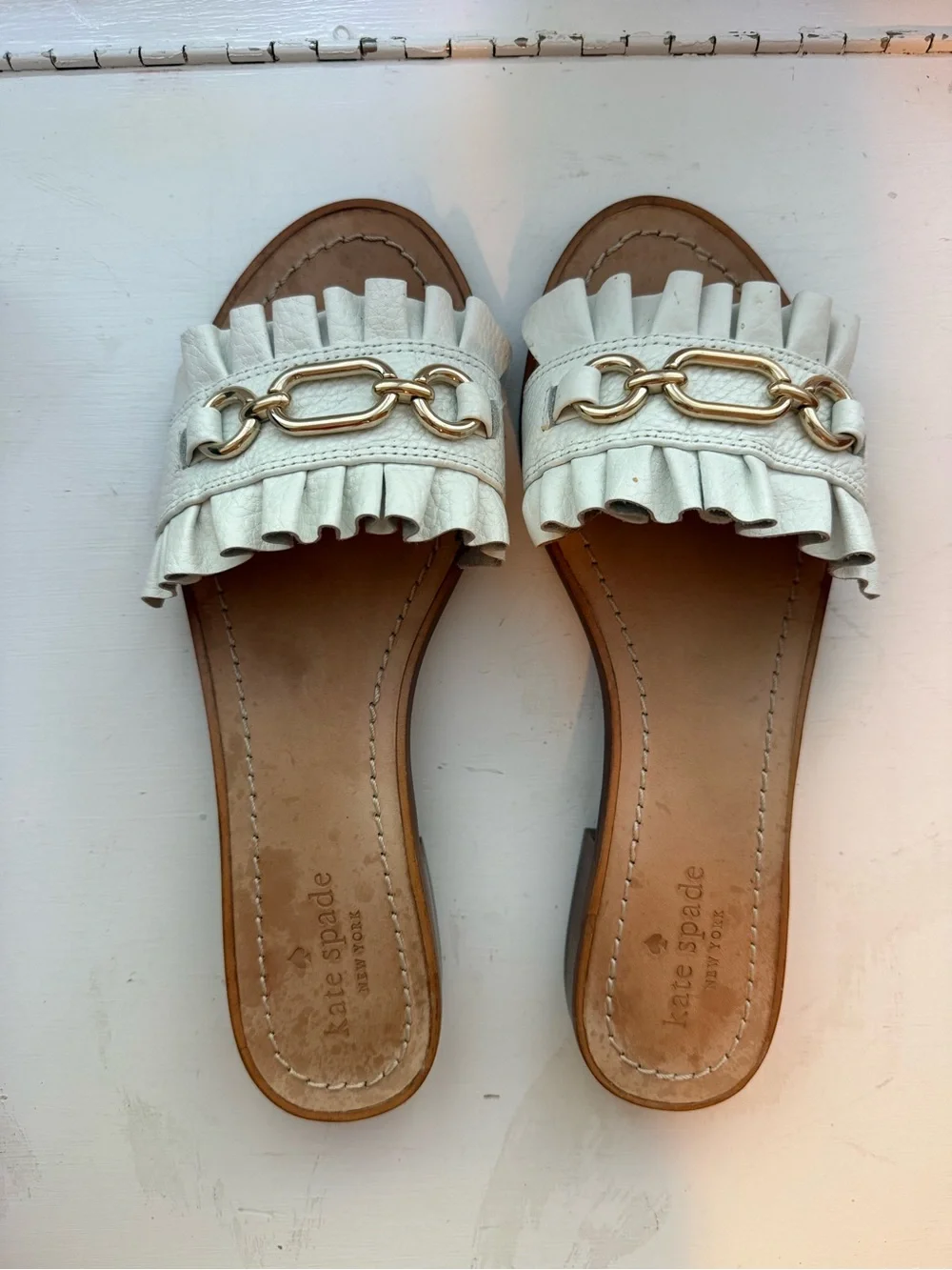kate spade White Ruffle Leather Slide Sandals with Gold Chain Detail