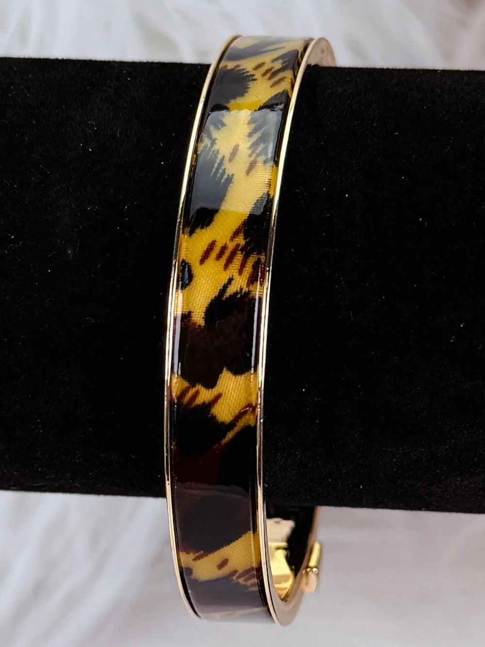 Beautiful, goldtone, animal print nine west bangle bracelet