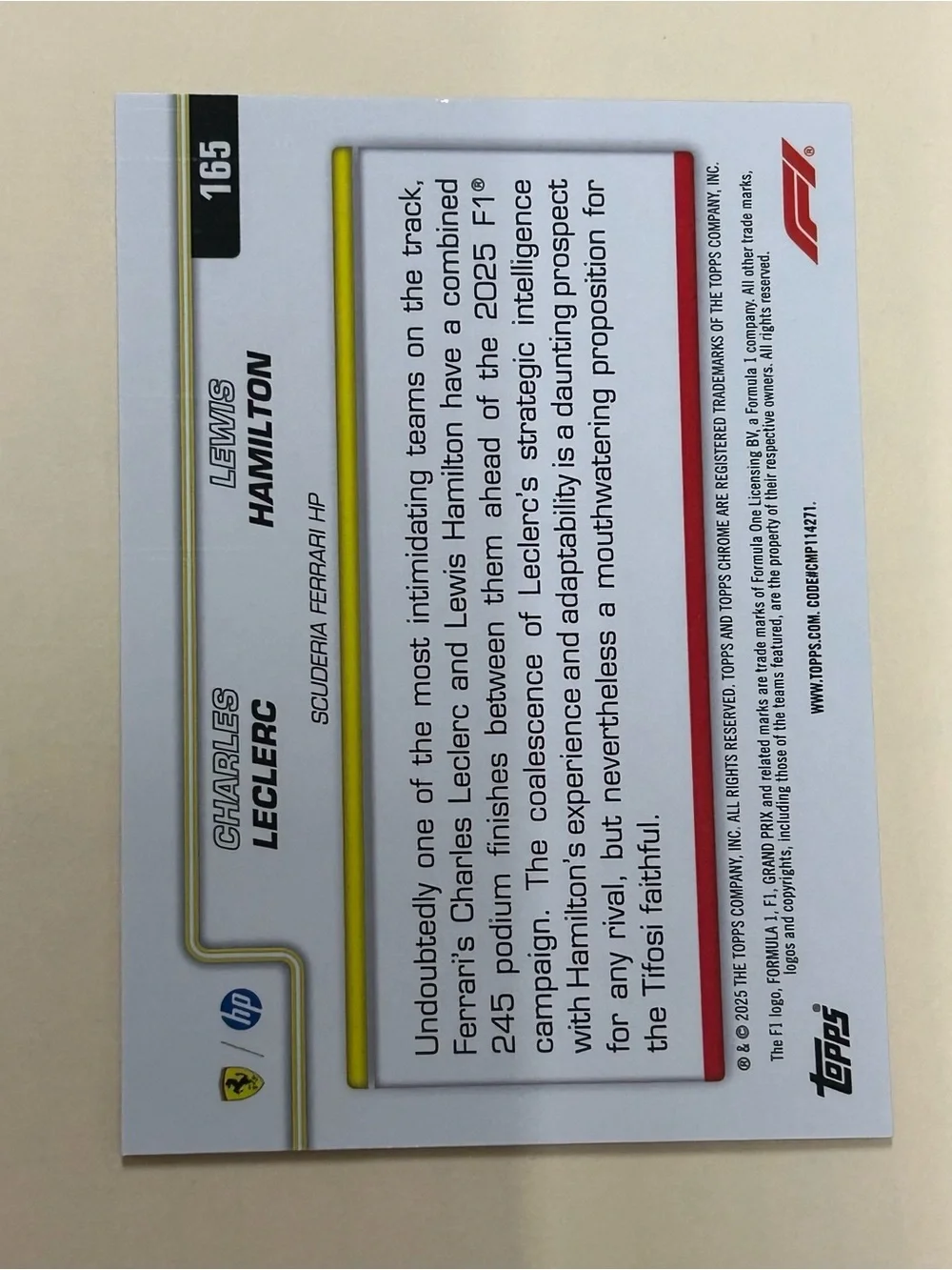 Topps White Racing Card with Red and Yellow Accents