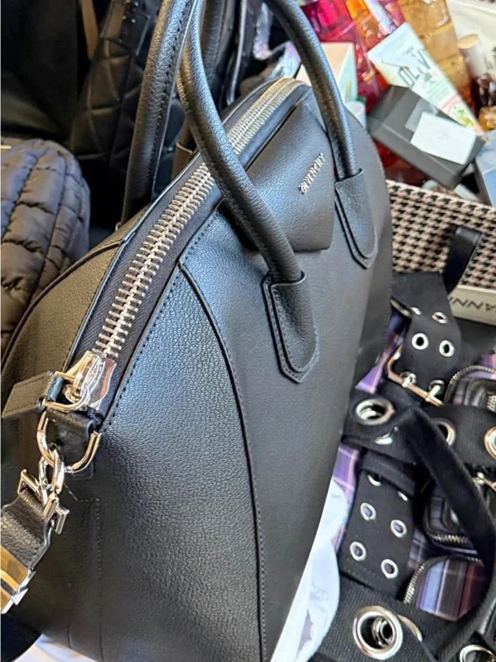 Black leather bag with strap