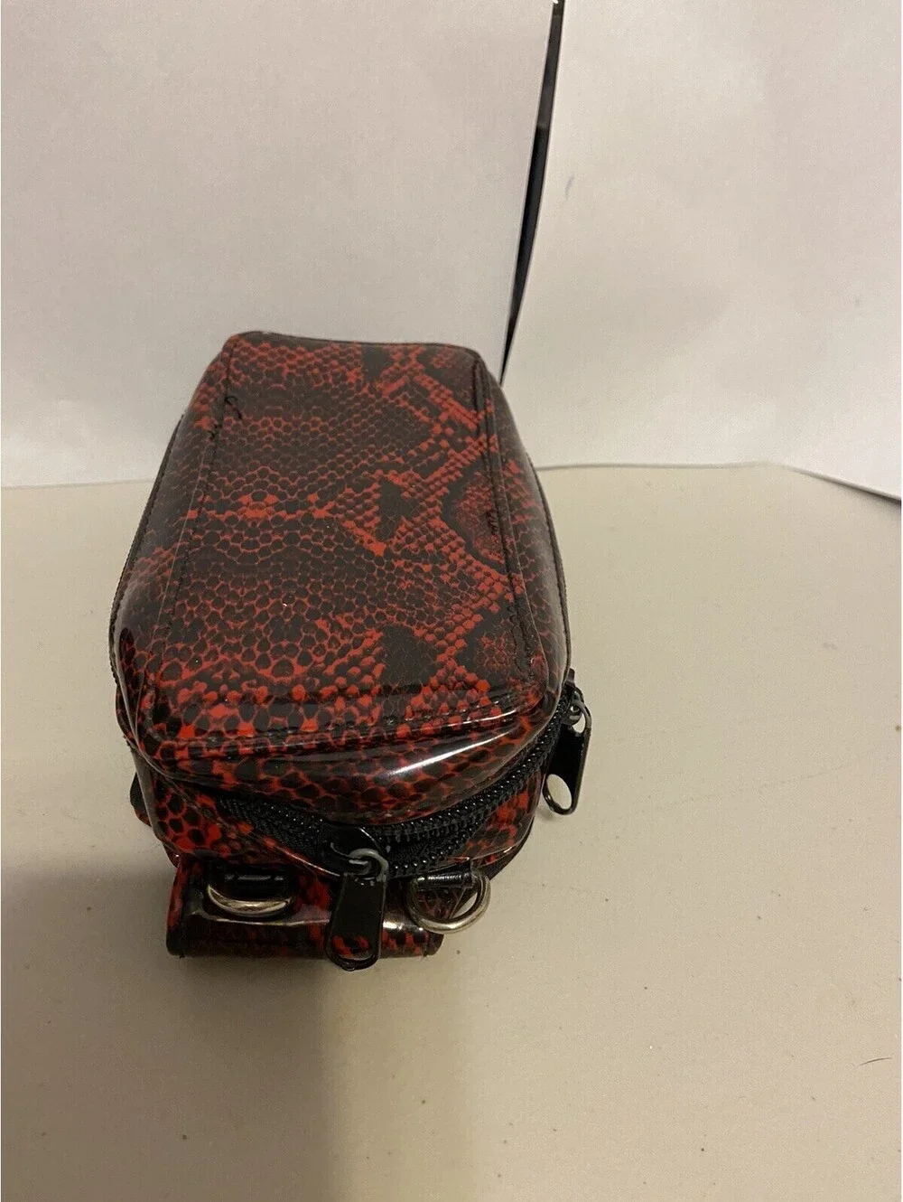 phone case red and black snakeskin look, vinyl. Fits I Phone.
