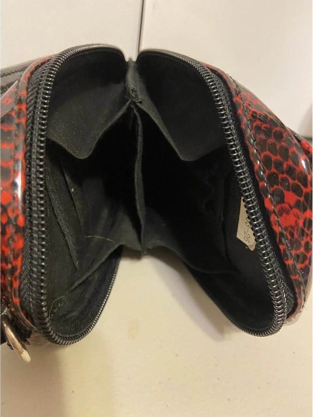 phone case red and black snakeskin look, vinyl. Fits I Phone.