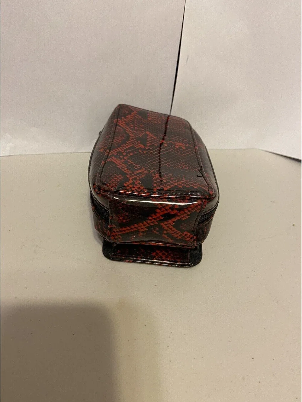 phone case red and black snakeskin look, vinyl. Fits I Phone.