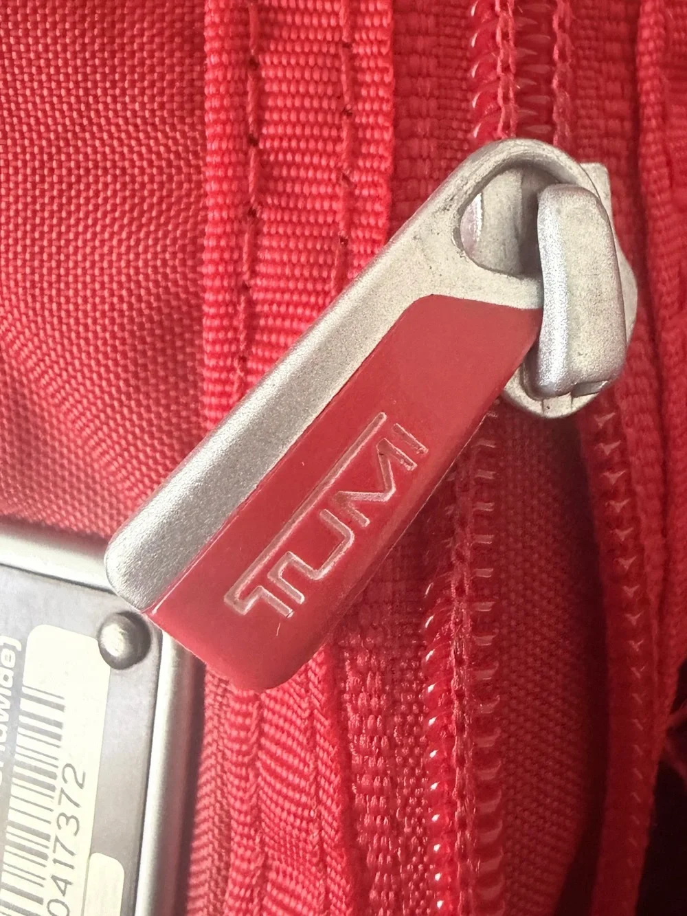 Tumi compact messenger