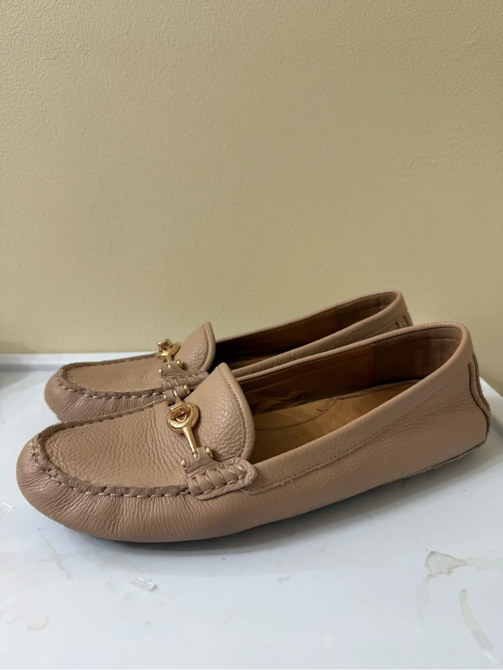 Coach leather wear driving