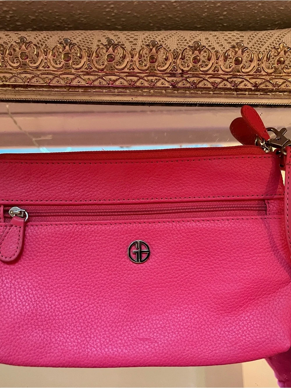 Giani Bernini genuine leather wristlet in a bright pink/fuchsia pebbled leather.