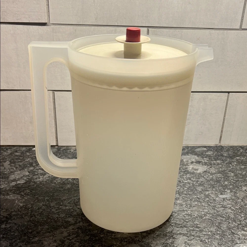 Vintage semi sheer push button Pitcher with Rust Accent. Excellent condition