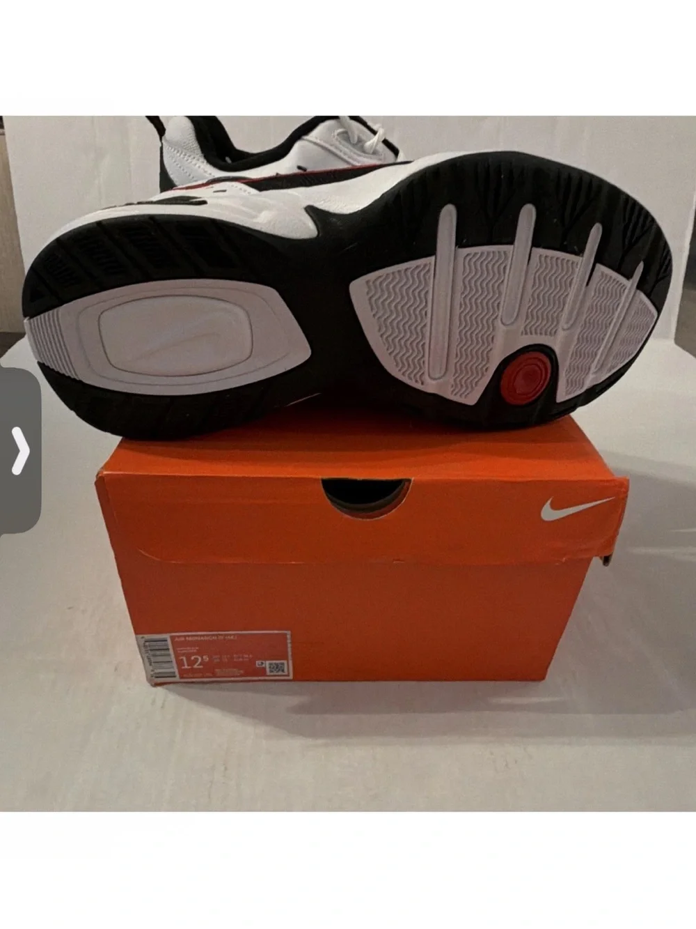 Nike Air Monarch IVMen’s White & Black Athletic Sneakers with Red Accents