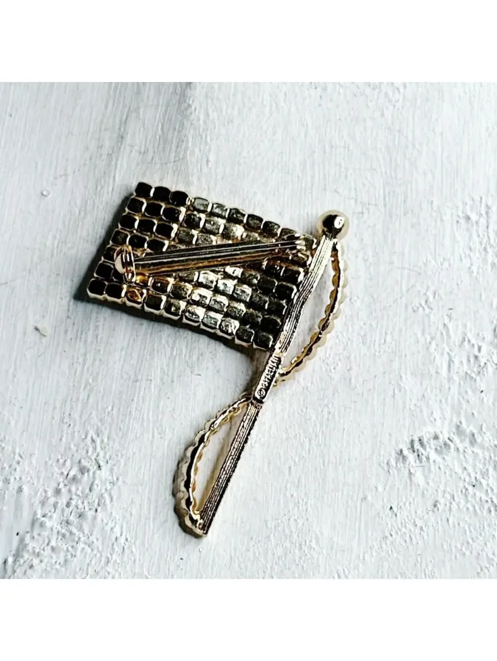 7595u. Goldtone Bling Flag Brooch