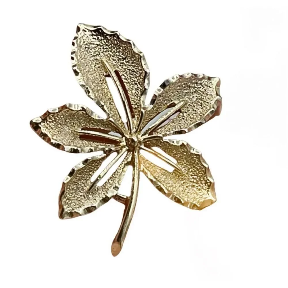 Vintage Sarah Coventry gold colored leaf brooch