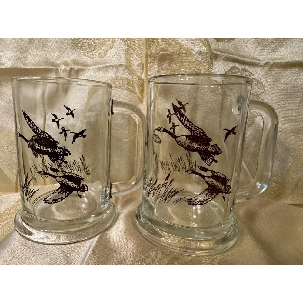 VTG AVON 1982 TANKARD MUGS STEIN CLEAR  GLASS WITH FLYING DUCKS/GEESE  Set Of 2