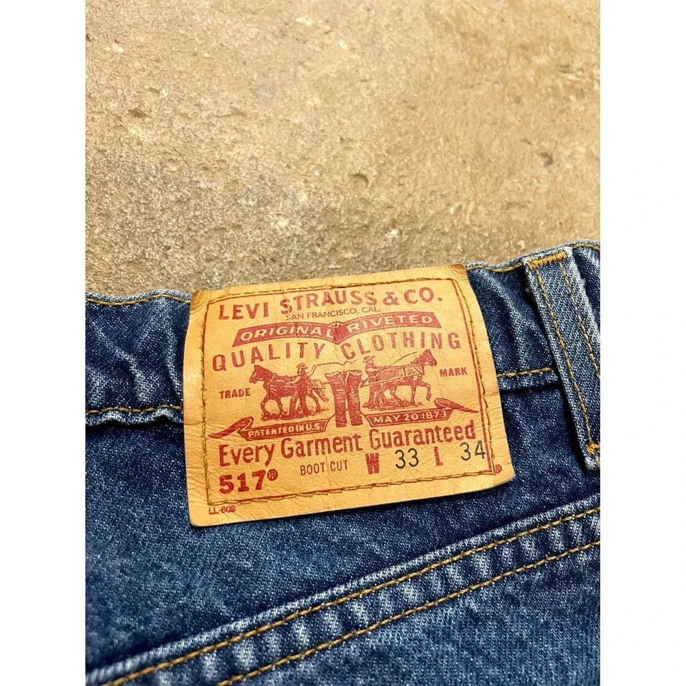 Vintage Levi's 517 Bootcut Jeans Mens 33x34 Blue Denim Distressed Cotton Raw Hem