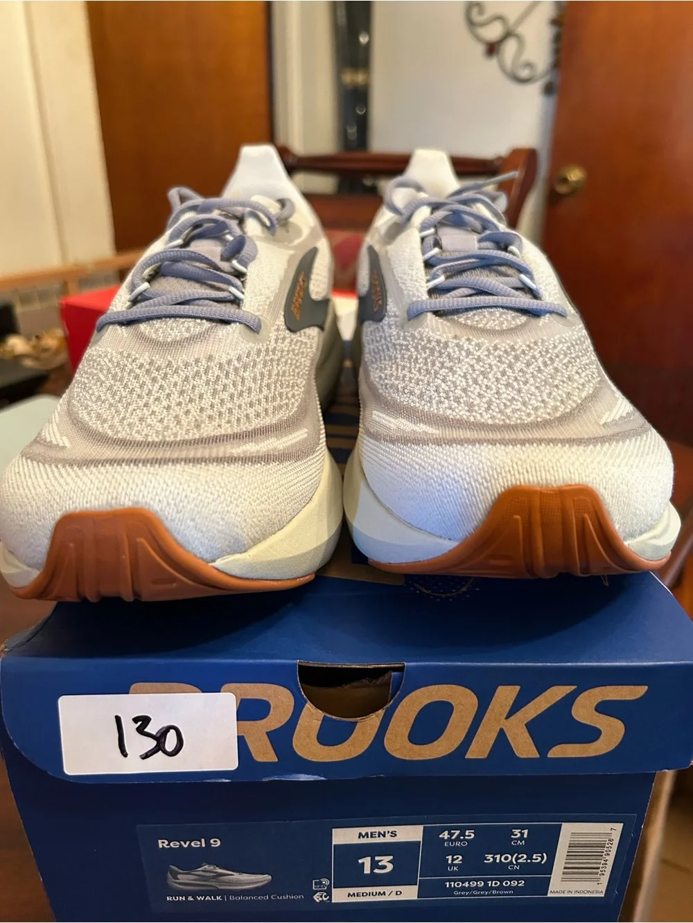 Men’s Brooks light gray and blue knit running shoes with gum outsole