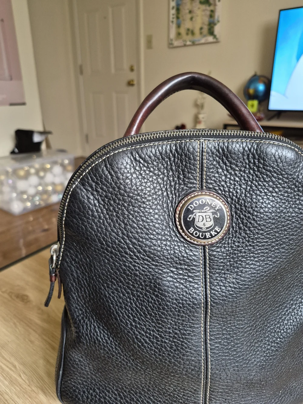 Dooney & Bourke finish silhouette