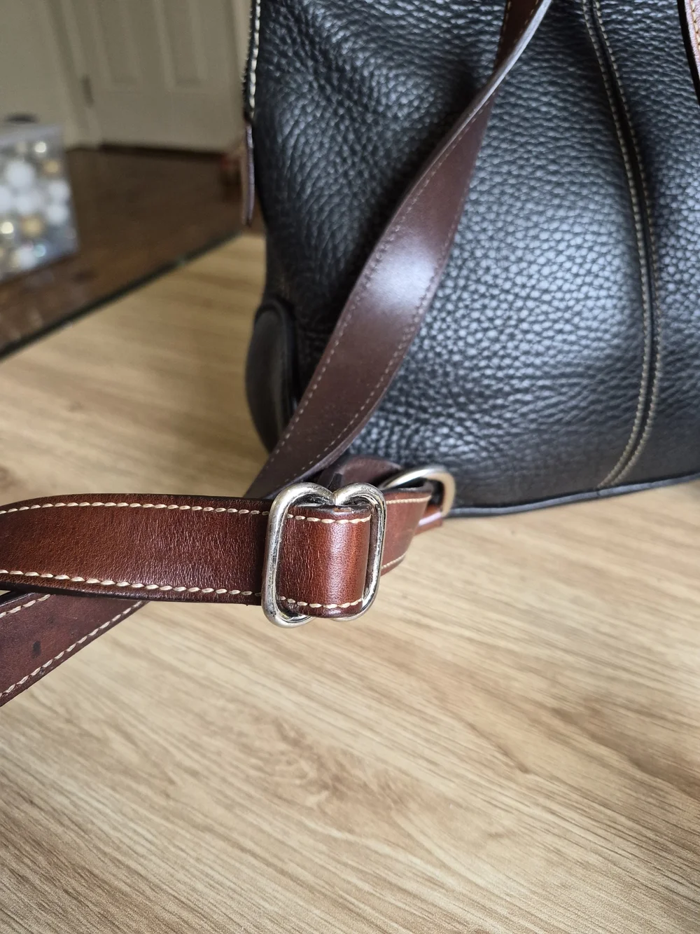 Dooney & Bourke brown finish available