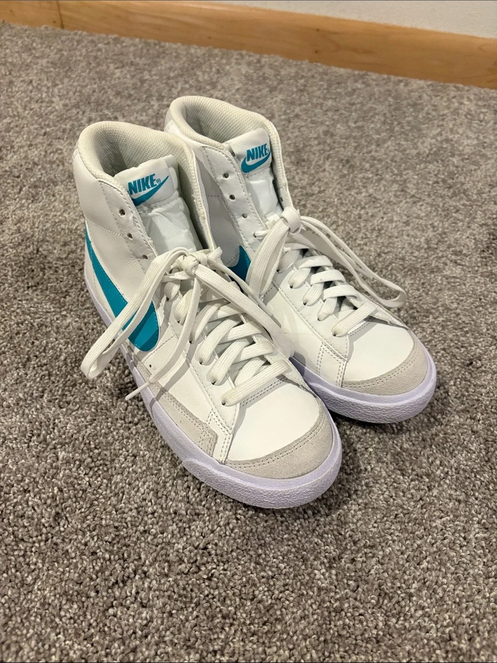Nike White High-Top Sneakers with Teal Swoosh Accents