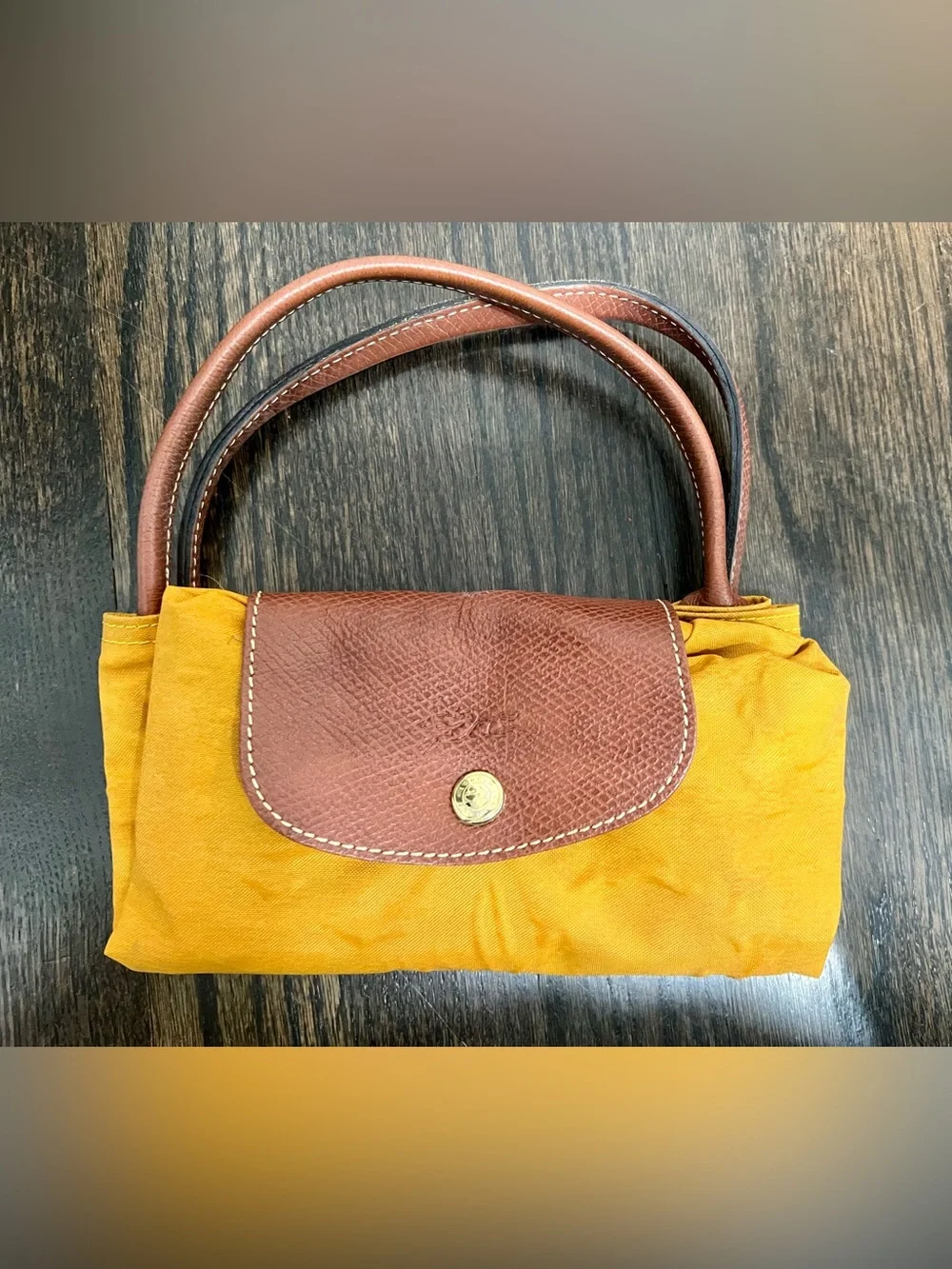 Longchamp features zipper work