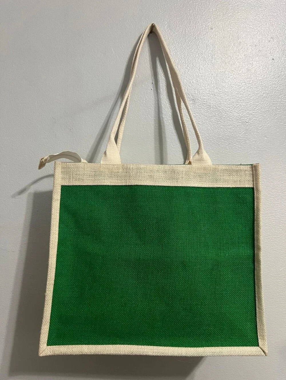 Boho-Chic Natural Jute Handbag with Cross-Stitch Embroidery.