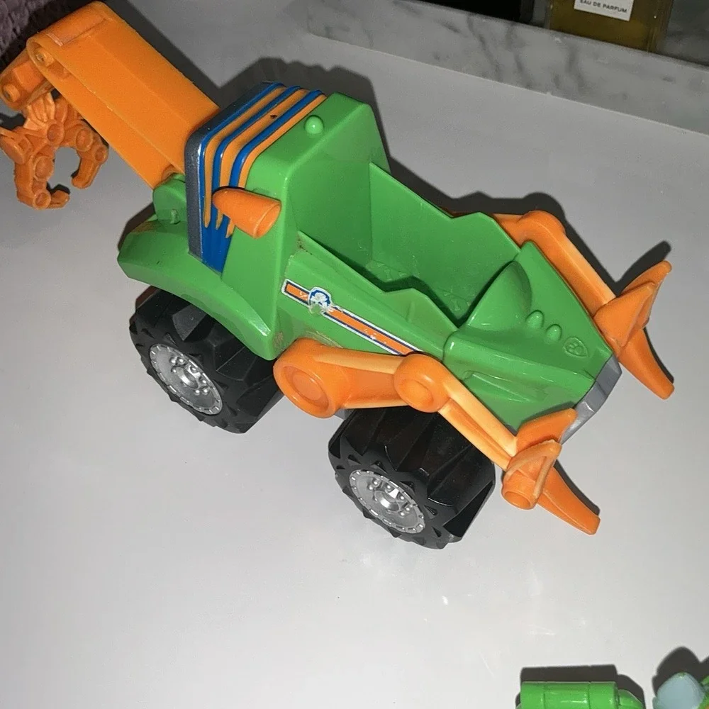 Paw Patrol Rocky Rev Up Deluxe Dino Rescue Vehicle with Dinosaur & Figure