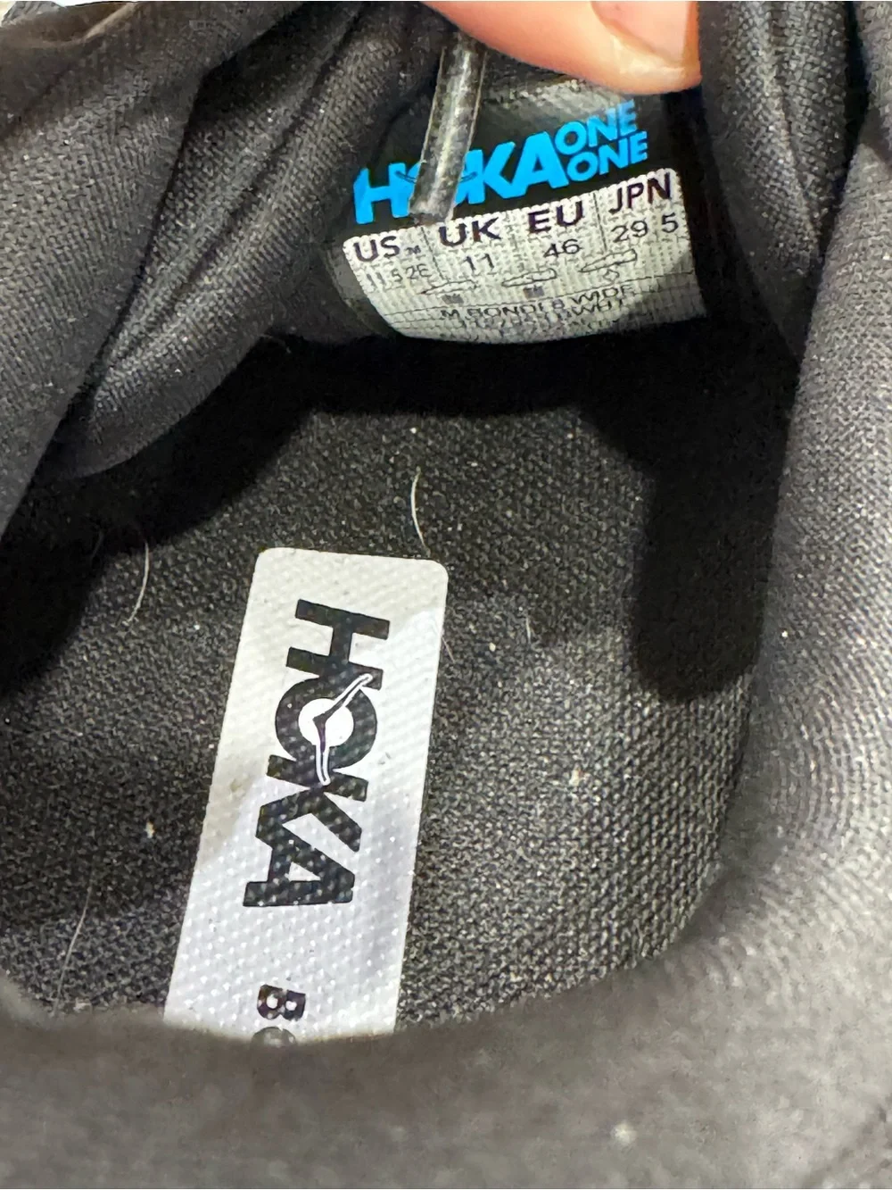 Hoka One One Bondi 8 running shoes feature a black upper and a white midsole
