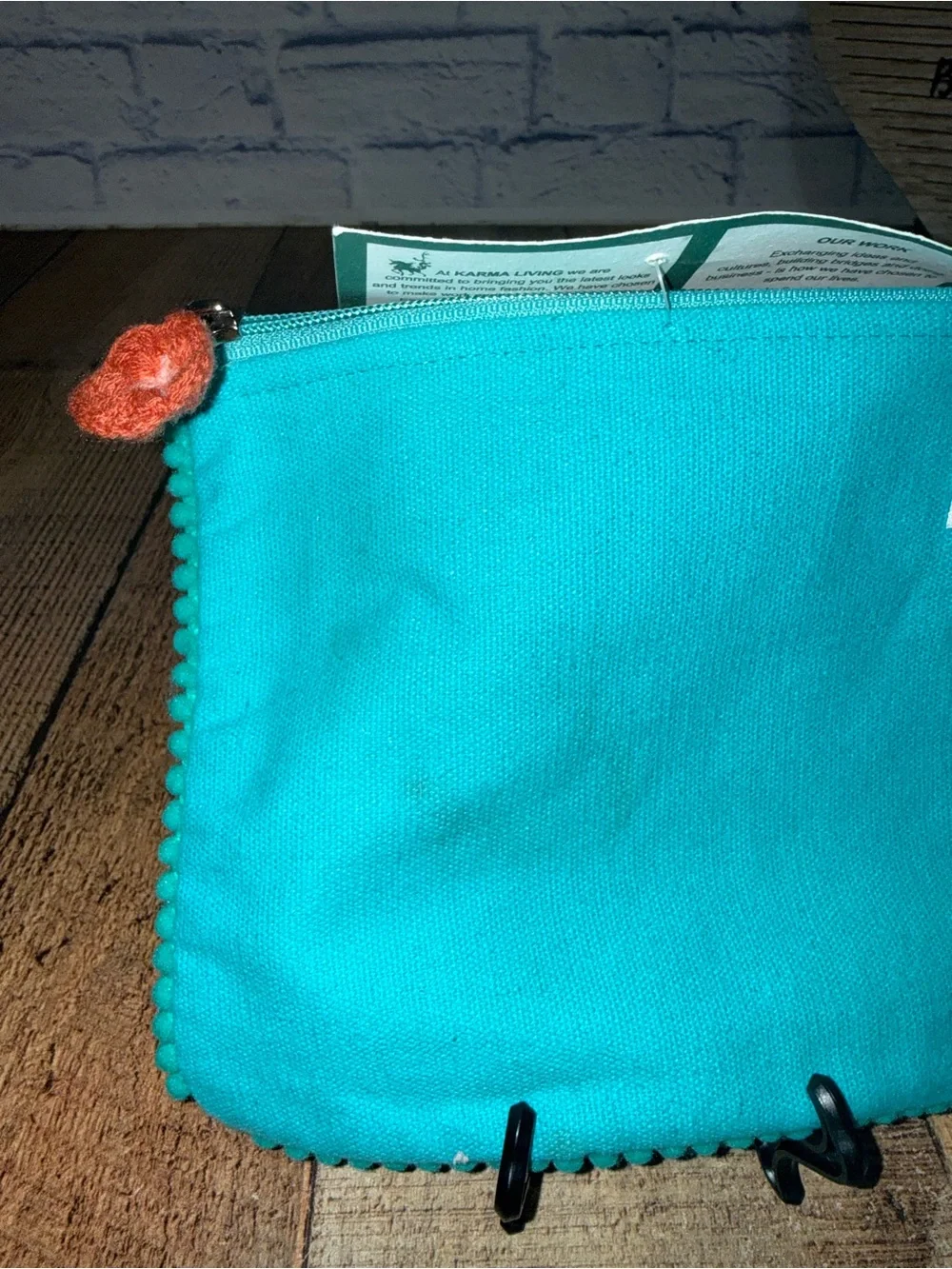 Karma living cat face Pom Pom pouch new with flaws