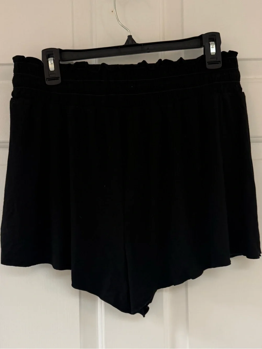 New Halara stretchy black shorts with tie at waist and flowy panels on the front