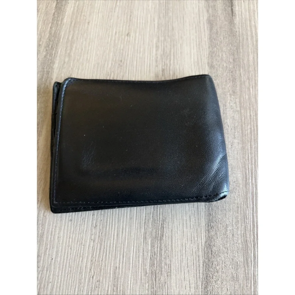 Tumi black leather