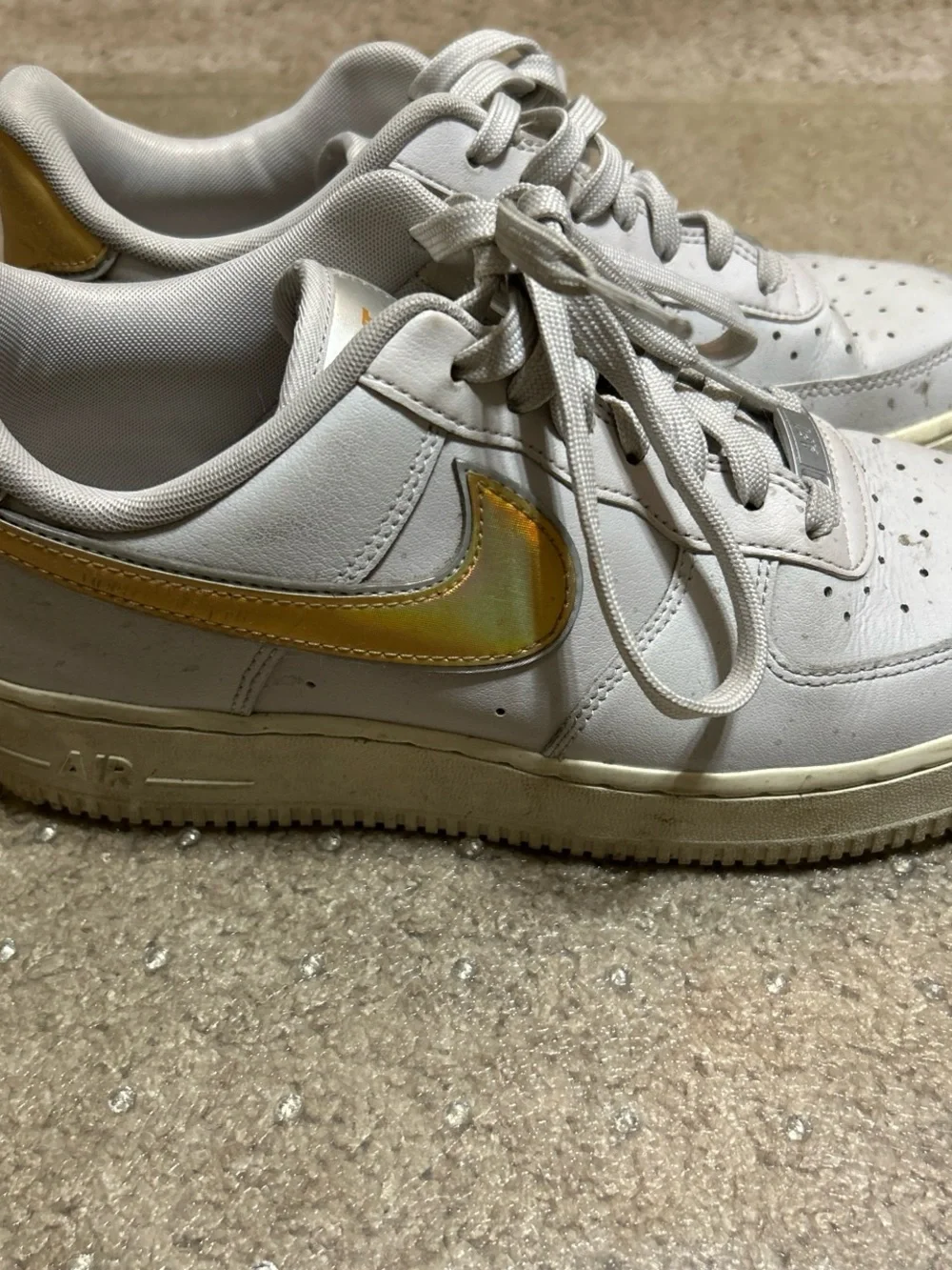 Nike White Athletic Shoes with Gold Swoosh