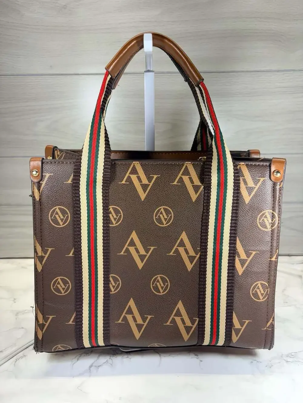 Adrienne Vittadini brown satchel handbag featuring an 