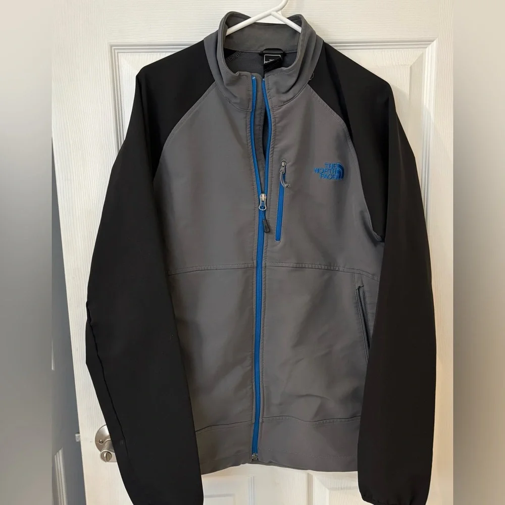 The North Face Men’s Gray Softshell‎ Jacket with Black Sleeves and Blue Trim