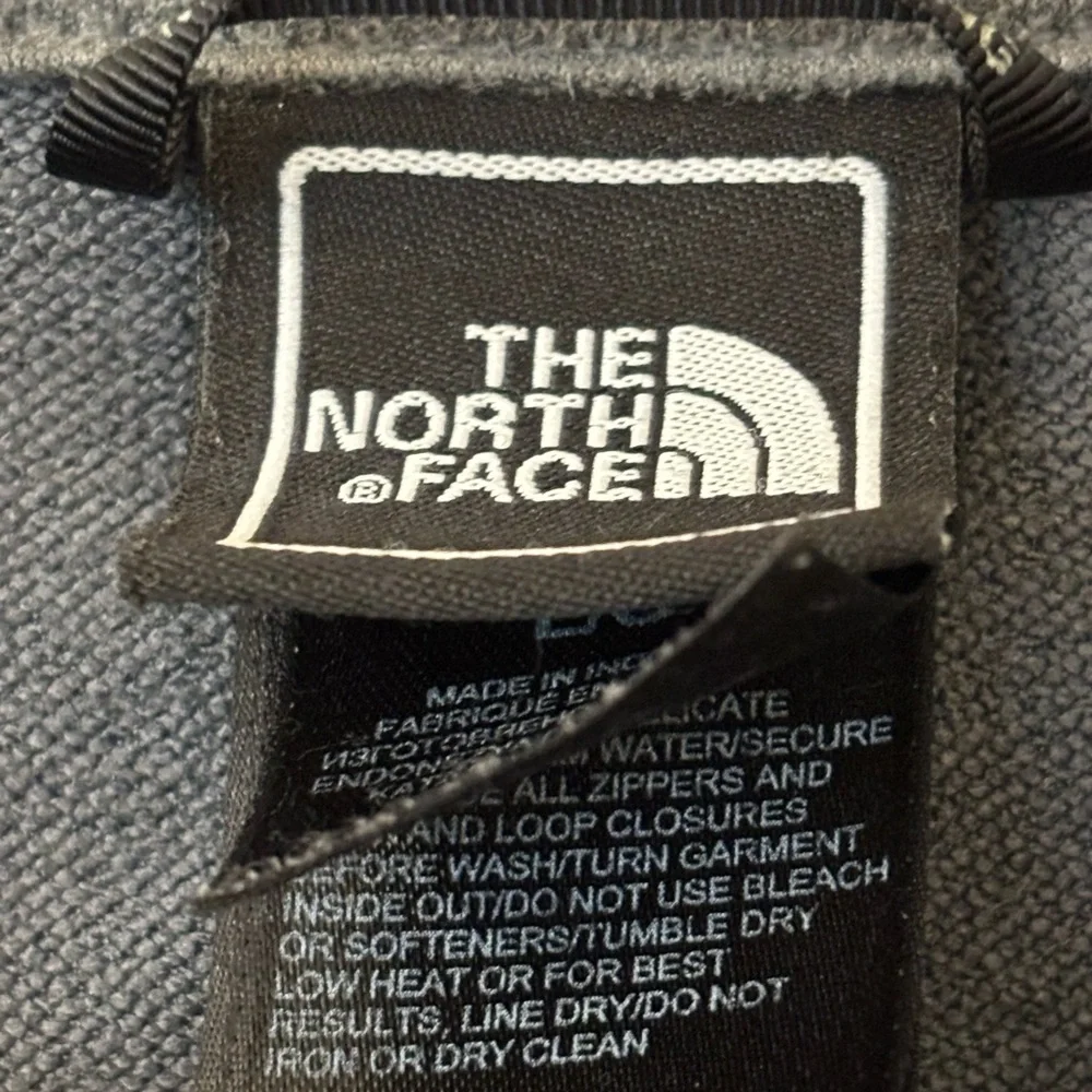 The North Face Men’s Gray Softshell‎ Jacket with Black Sleeves and Blue Trim