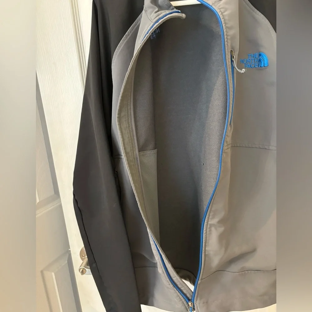 The North Face Men’s Gray Softshell‎ Jacket with Black Sleeves and Blue Trim