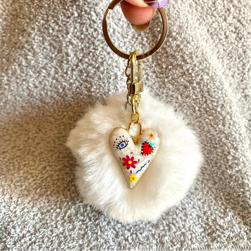 🎅🏻 SALE! White Fuzzy ball with heart charm bag charm Or key chain brand new