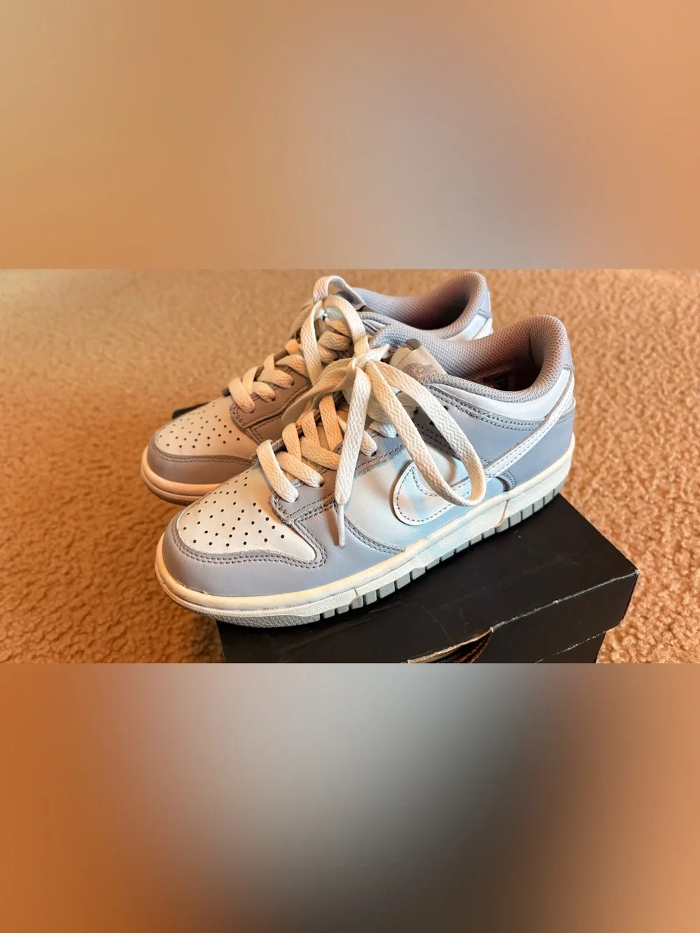 Nike Kids Low-Top Sneakers in Pale Blue and White with no creases.
