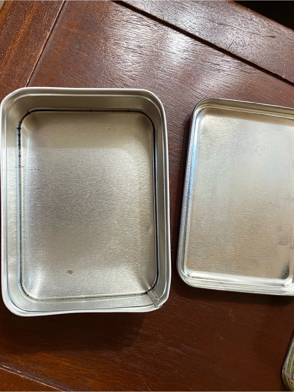 Two vintage tin containers