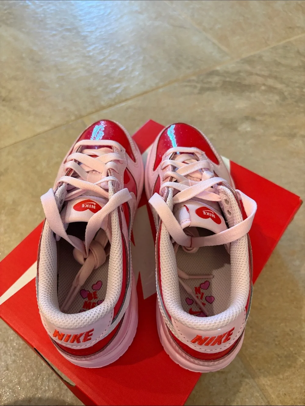 Nike Kids Pink and Red Low-Top Sneakers with White Swoosh
