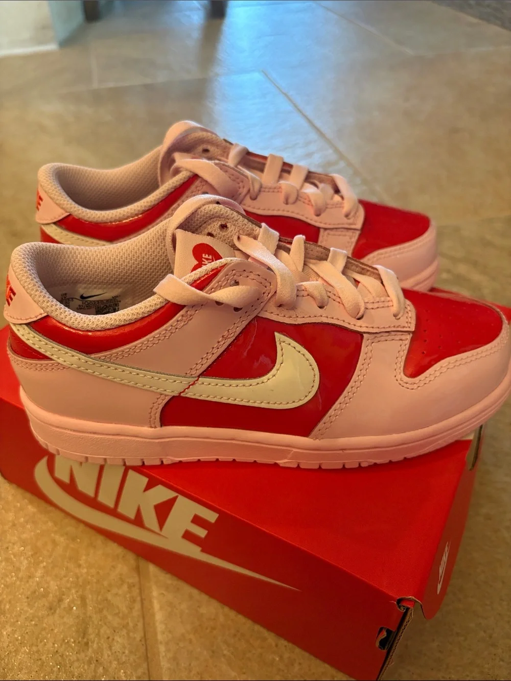 Nike Kids Pink and Red Low-Top Sneakers with White Swoosh